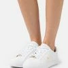 Lacoste POWERCOURT - Trainers - White/gold -Lacoste Sales Store 228a8630da084ff18e6876c0d9b1769f