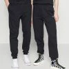 Lacoste UNISEX EXCLUSIVE - Tracksuit Bottoms - Black -Lacoste Sales Store a2ec71aec39a4101ab3f1d74c7c5509e