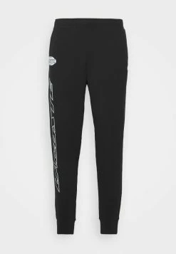 Lacoste EXCLUSIVE - Tracksuit Bottoms - Black -Lacoste Sales Store af737c834e7744be86b37821f55d05d0