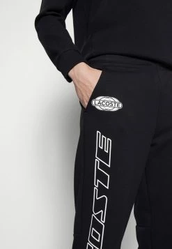 Lacoste EXCLUSIVE - Tracksuit Bottoms - Black -Lacoste Sales Store d1489fa1e9564369a665a2f049a0a8a6
