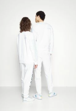 Lacoste UNISEX EXCLUSIVE - Tracksuit Bottoms - White -Lacoste Sales Store fd1de0a523ca43bf99c3d63d38f75cf5
