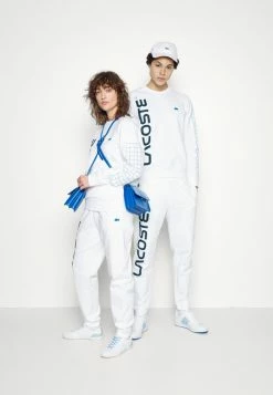 Lacoste UNISEX EXCLUSIVE - Tracksuit Bottoms - White -Lacoste Sales Store fd7875cc47f04333a85c8dba291a9440